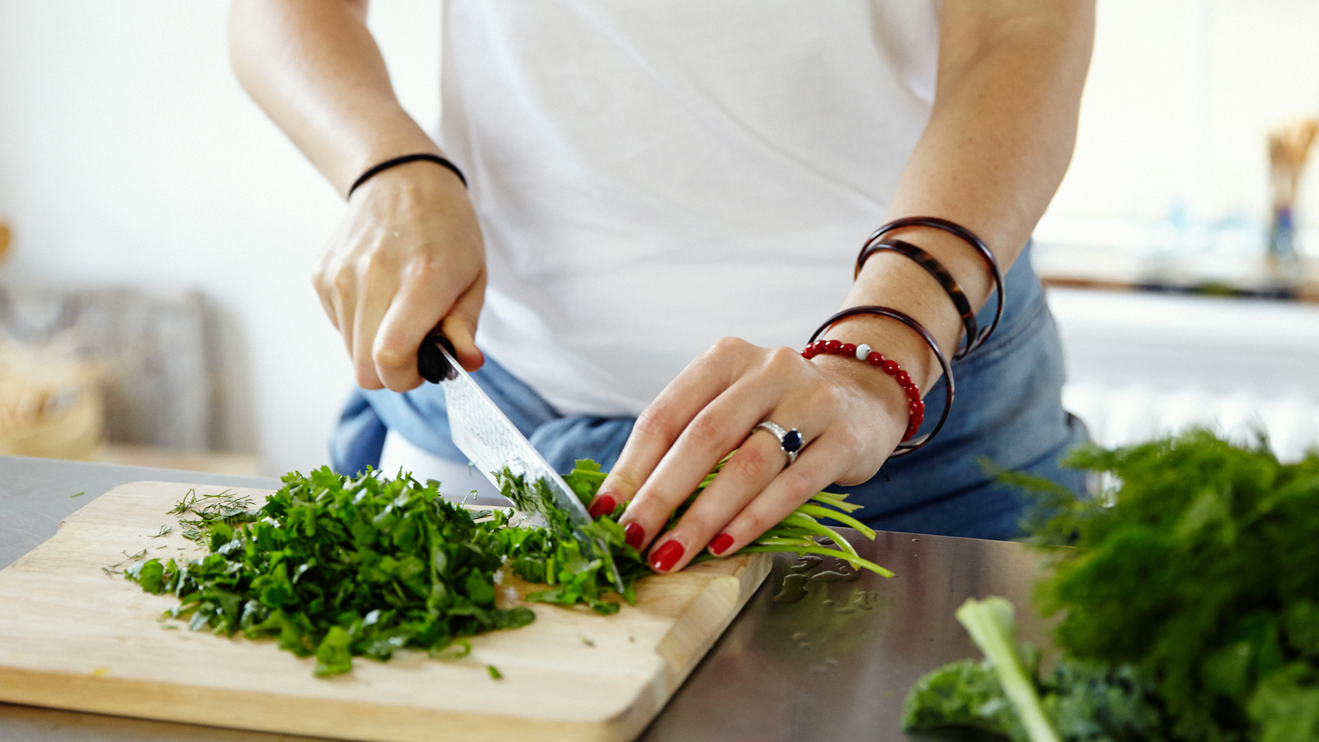catherine-cuello-chopping-herbs-for-her-recipe-for-french-lentils-with-a-ton-of-herbs-foodadit
