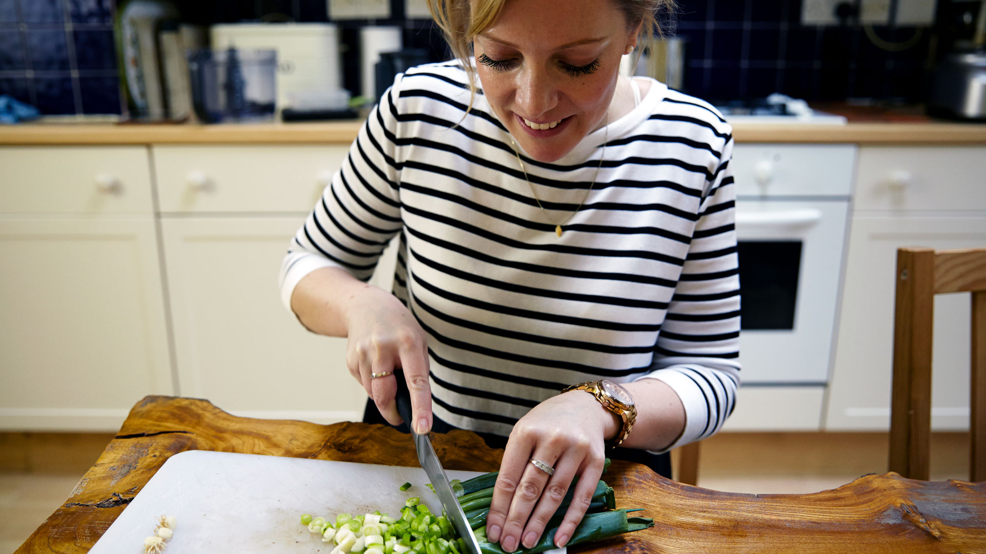 Karen Arkell chopping spring onions for her Tuna Burgers with Mustard Beetroot Salad recipe.