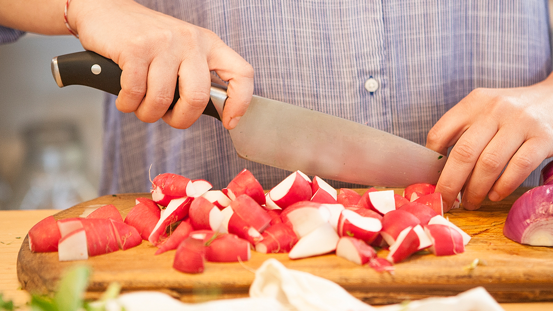 Cutting radishes for a spring salad